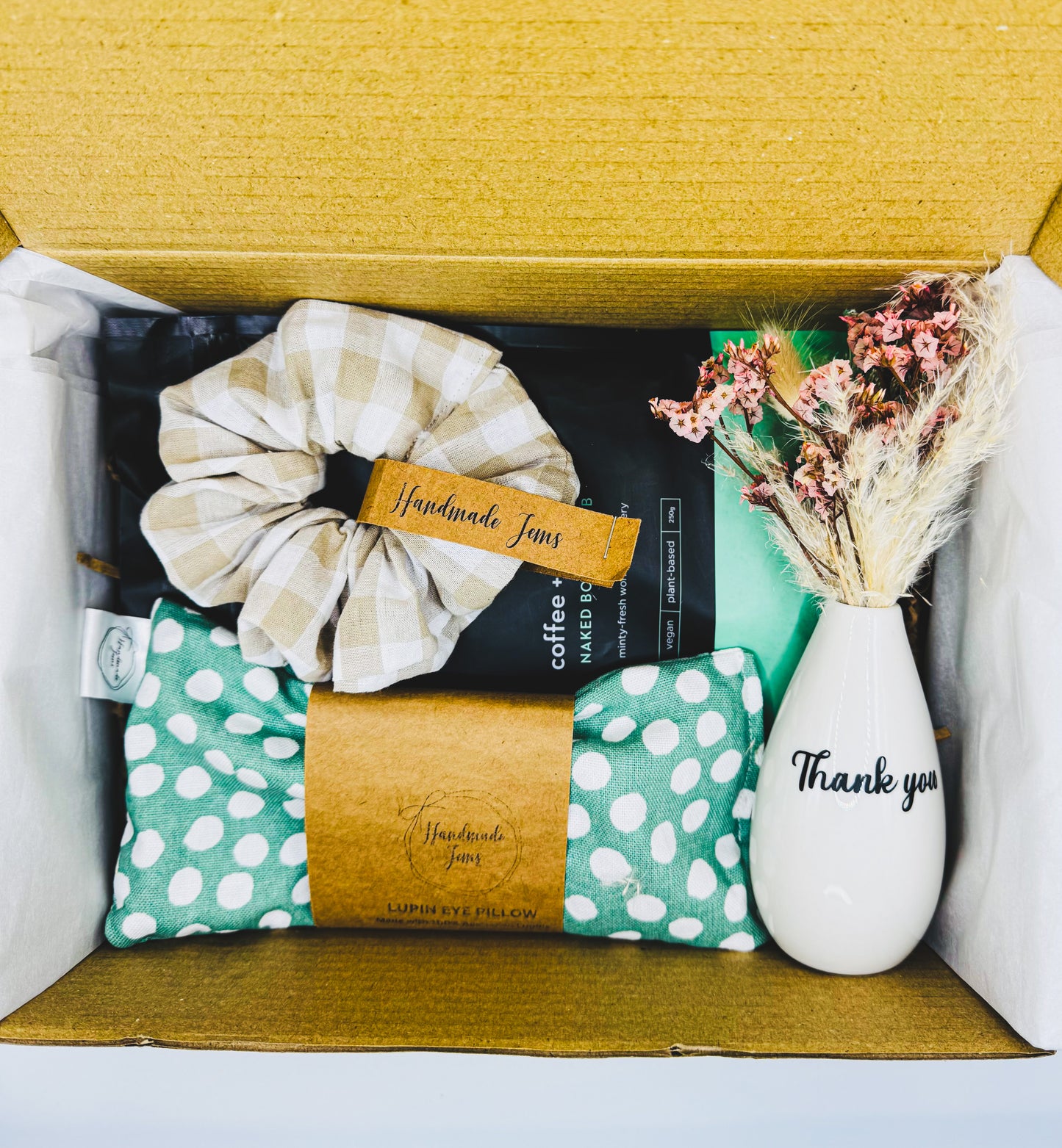 Gift set with scrunchie, pillow, and vase in a box