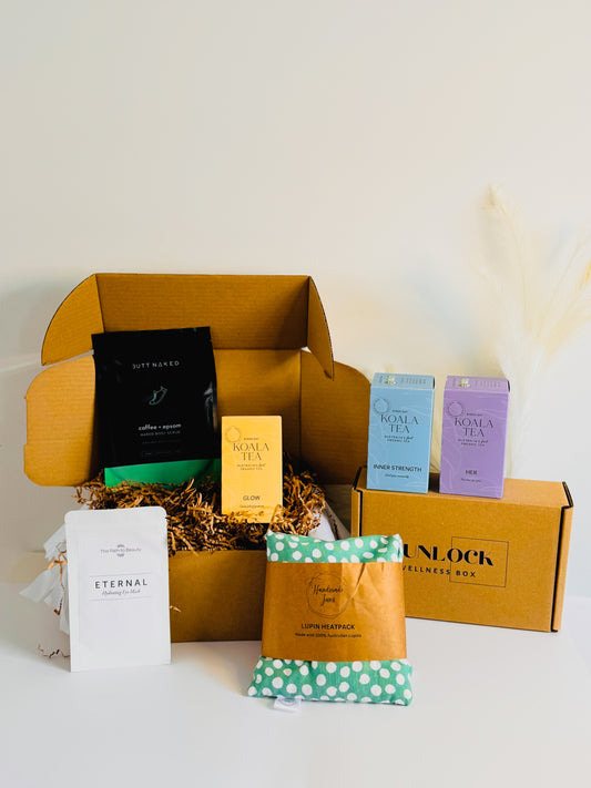 Bloom & Brew Self-Care Hamper featuring coffee scrub, tea blend, heat pack, and silk eye mask arranged in a gift box