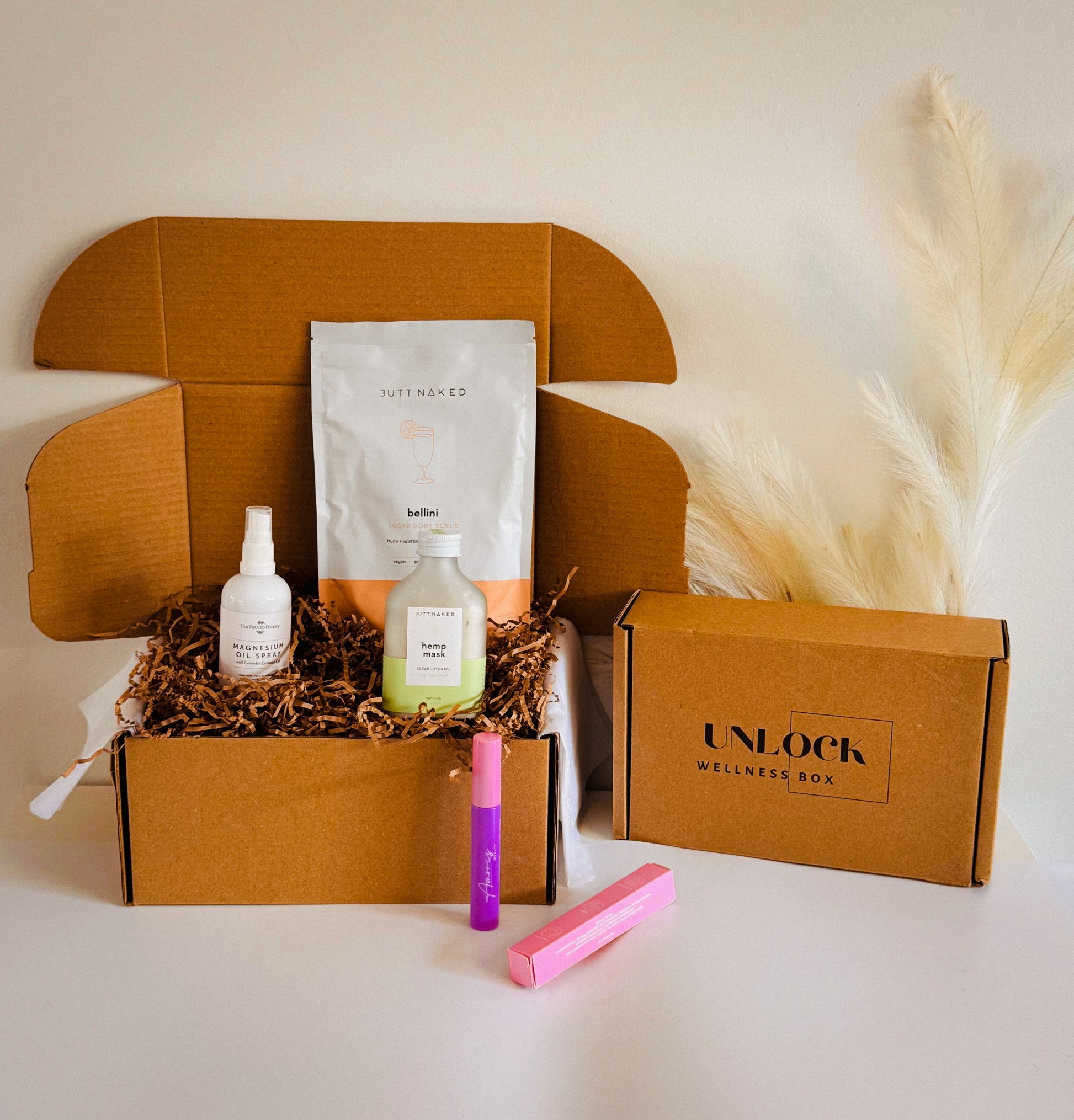 wellness gift box with products magnesium spray, hemp face mask, hair wand, body scrub 