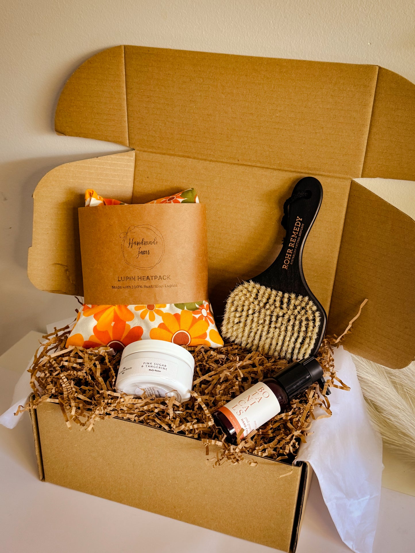 Gift box with beauty products dry brush, heat pack, body scrub, hand cream 