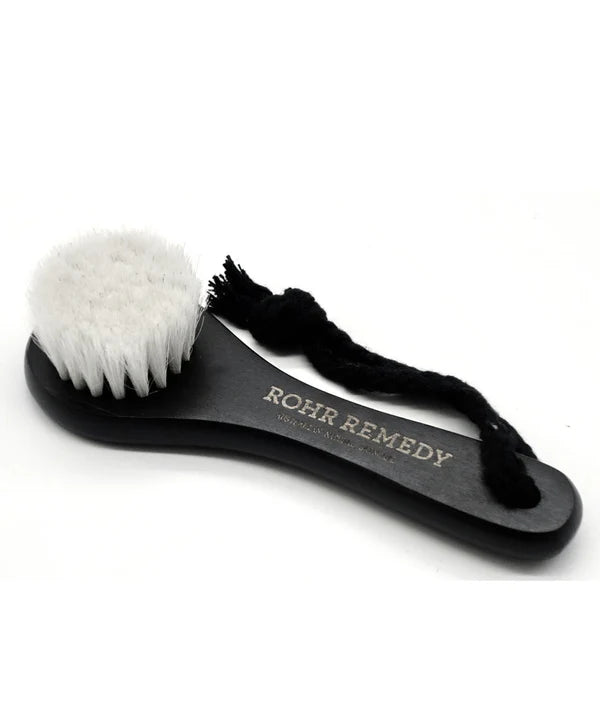 Black brush with white bristles on a white background, branded 'Rohr Remedy'.